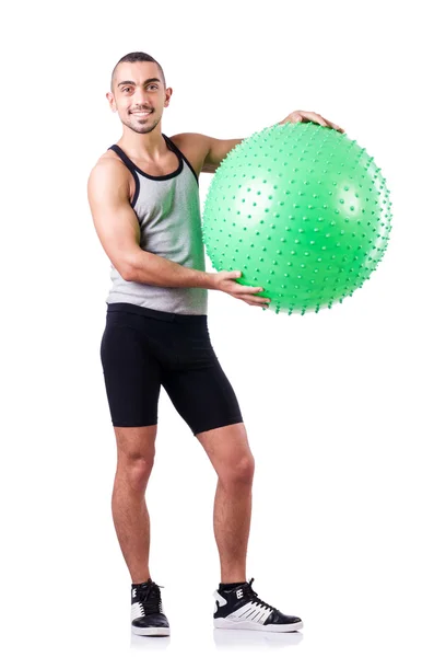Homem com bola suíça fazendo exercícios em branco — Fotografia de Stock