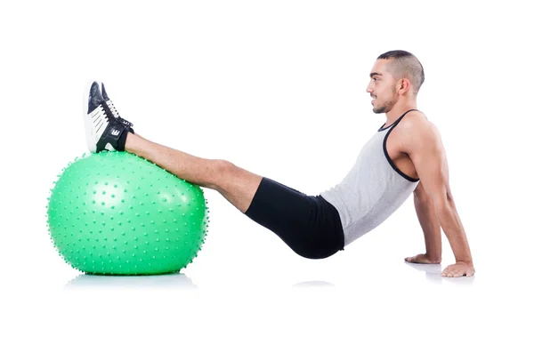 Man with swiss ball doing exercises on white — Stock Photo, Image