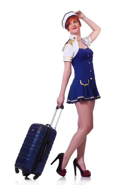 Kvinnlig reseassistent med resväska på vitt — Stockfoto