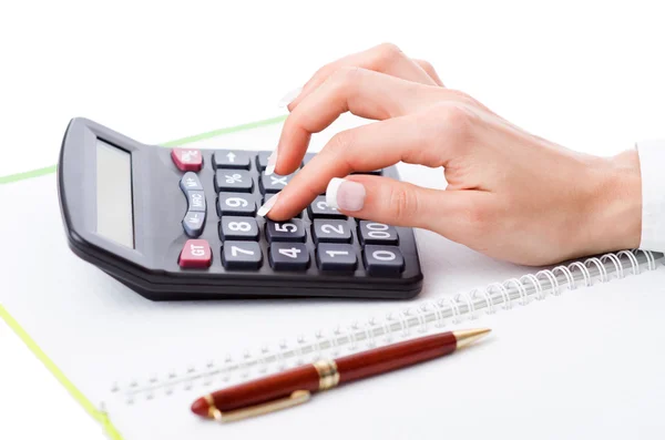 Hands working on the calculator — Stock Photo, Image