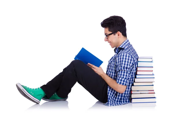 Studente met veel boeken over wit — Stockfoto