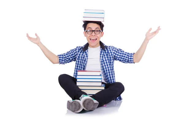 Student mit vielen Büchern auf weiß — Stockfoto