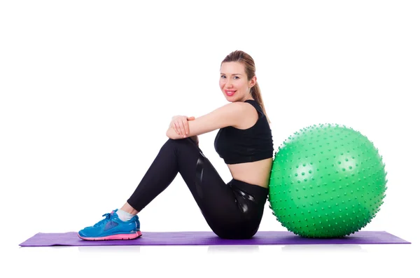 Mulher fazendo exercícios com bola no branco — Fotografia de Stock