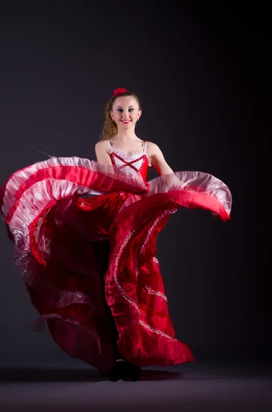 Girl in red dress dancing dance — Stock Photo, Image