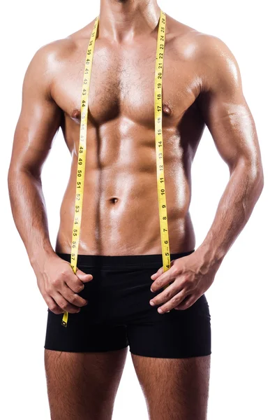 Hombre musculoso midiendo sus músculos —  Fotos de Stock