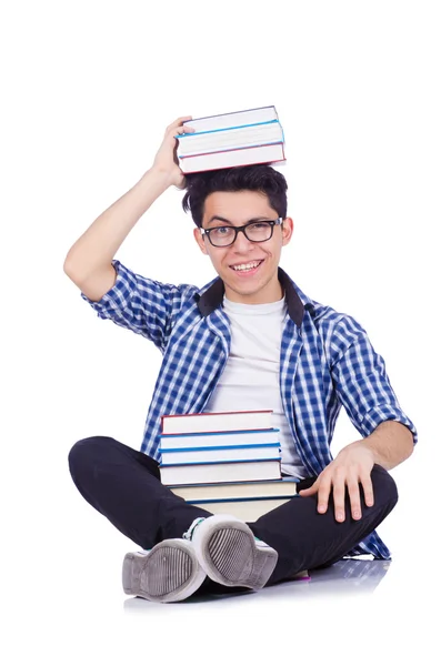 Студент з великою кількістю книг на білому — стокове фото