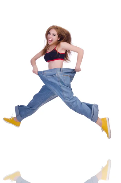 Vrouw in dieet concept met grote jeans — Stockfoto