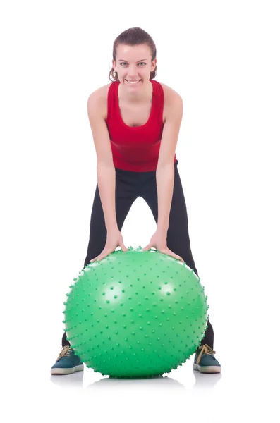 Young woman with ball exercising on white — Stock Photo, Image