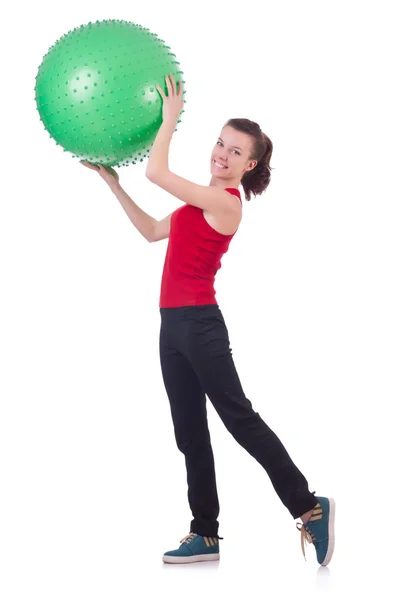 Mujer joven con pelota haciendo ejercicio sobre blanco —  Fotos de Stock