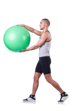 İsviçre toplu bir adam beyazlar üzerinde egzersiz yapıyor.