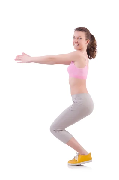 Mujer joven haciendo ejercicios en blanco — Foto de Stock