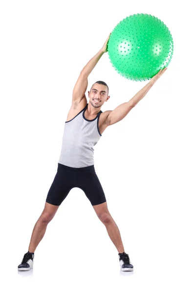 Hombre con pelota suiza haciendo ejercicios en blanco — Foto de Stock