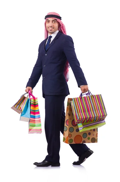 Hombre árabe con regalos de compras en blanco — Foto de Stock