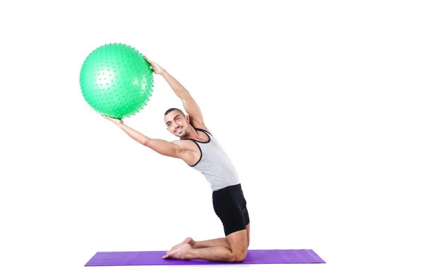 Man with swiss ball doing exercises on white — Stock Photo, Image