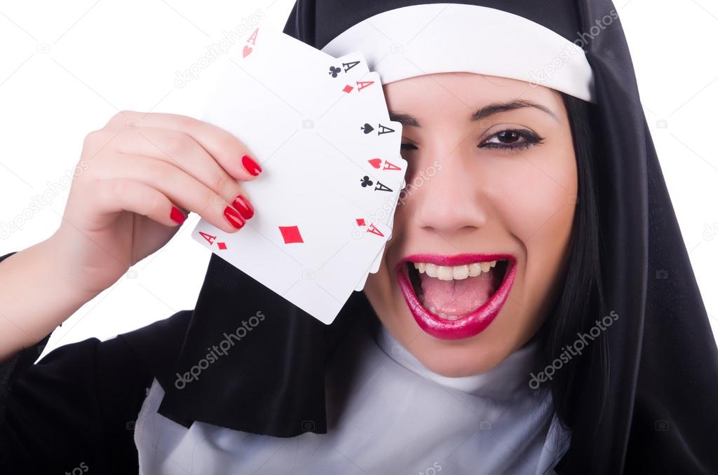 Nun playing cards on white