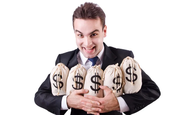 Businessman with sacks of money on white — Stock Photo, Image