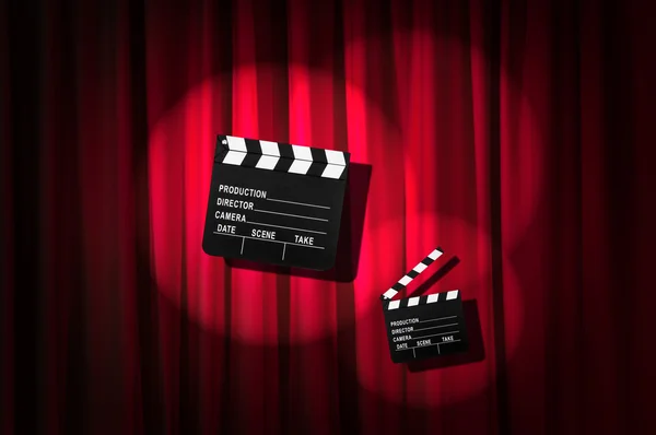 Movie clapper board against curtain — Stock Photo, Image