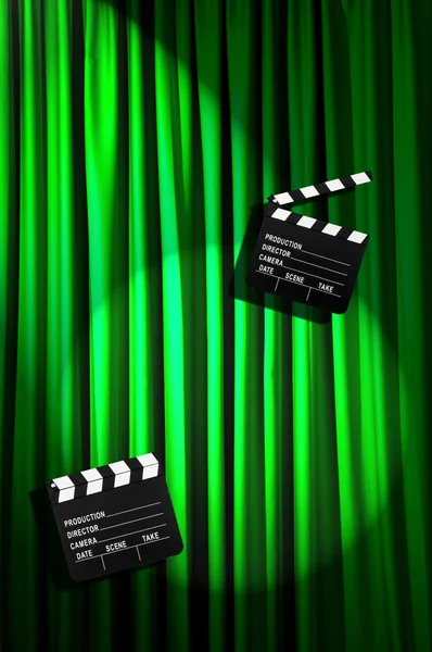 Movie clapper board against curtain — Stock Photo, Image