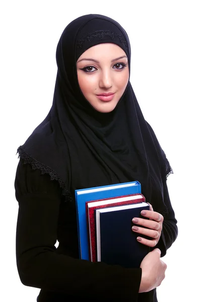Jovem mulher muçulmana com livro sobre branco — Fotografia de Stock
