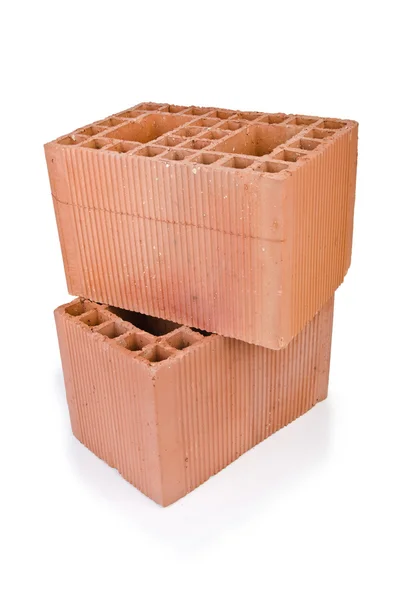 Stack of clay bricks isolated on white — Stock Photo, Image