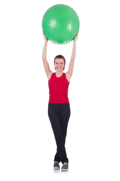 Mujer joven con pelota haciendo ejercicio sobre blanco —  Fotos de Stock