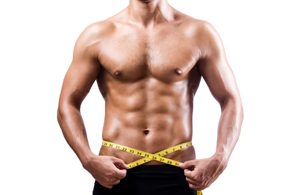 Muscular man measuring his muscles — Stock Photo, Image