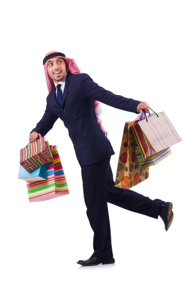 Arabische man met winkelcadeaus op wit — Stockfoto