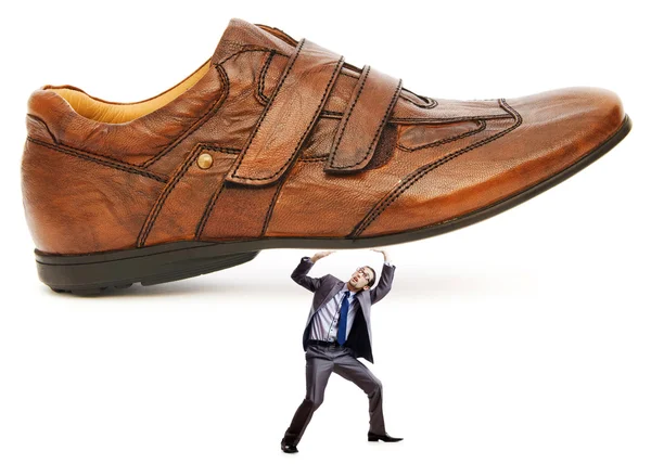 Woman domination concept with shoes and man — Stock Photo, Image
