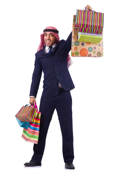 Homme arabe avec des cadeaux shopping sur blanc — Photo
