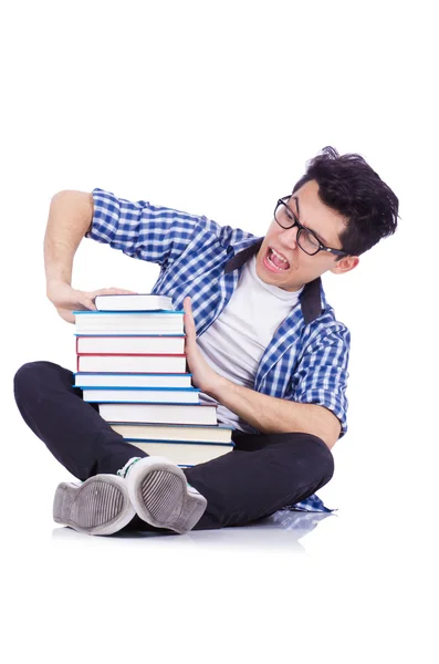 Student se spoustou knih na bílém — Stock fotografie