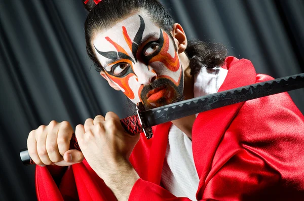 Man with sword and face mask — Stock Photo, Image