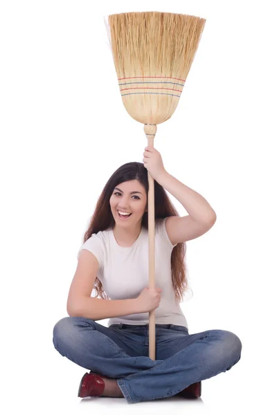 Giovane donna con scopa isolata su bianco — Foto Stock