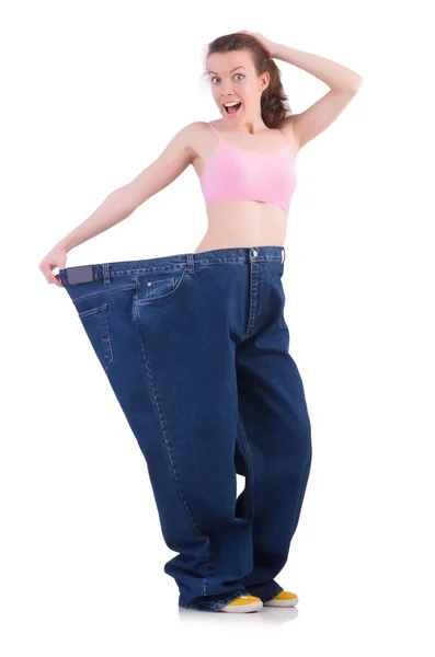 Woman in dieting concept with big jeans — Stock Photo, Image