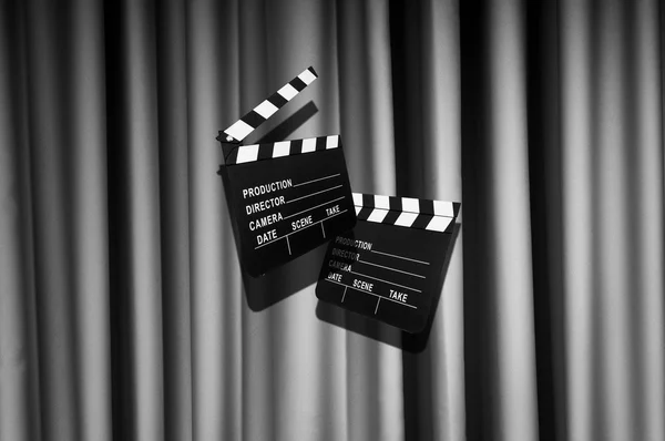 Movie clapper board against curtain — Stock Photo, Image