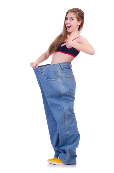 Woman in dieting concept with big jeans — Stock Photo, Image