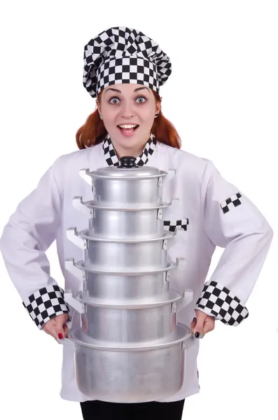 Cook with stack of pots on white — Stock Photo, Image