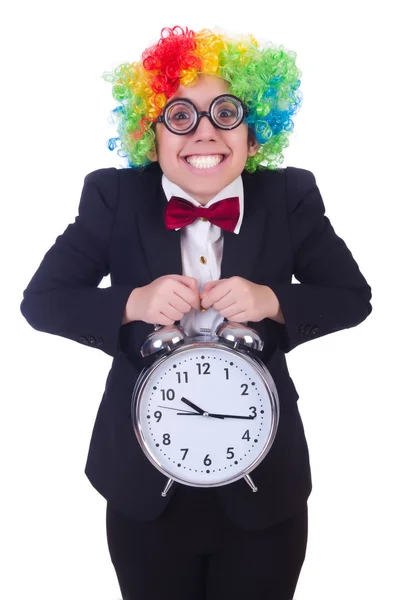 Grappige clown met klok op wit — Stockfoto