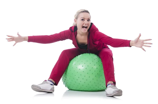 Young woman with ball exercising on whitee — Stock Photo, Image