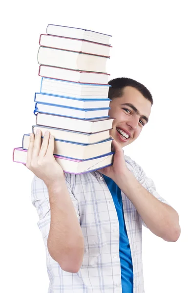 Student mit vielen Büchern auf weiß — Stockfoto