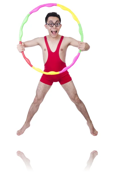 Esportista engraçado com hula hoop em branco — Fotografia de Stock