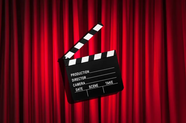 Movie clapper board against curtain — Stock Photo, Image