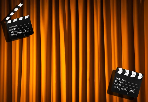 Movie clapper board against curtain — Stock Photo, Image