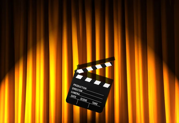 Movie clapper board against curtain — Stock Photo, Image