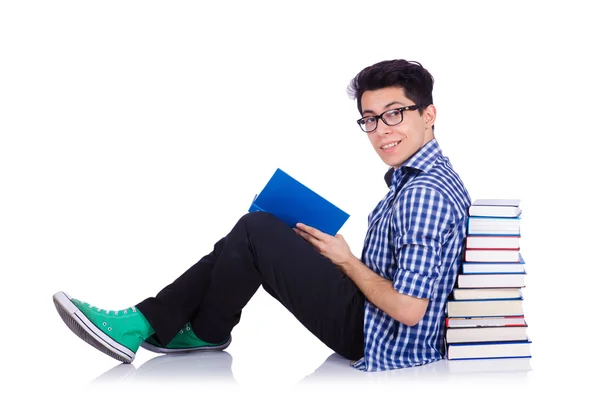 Student mit vielen Büchern auf weiß — Stockfoto