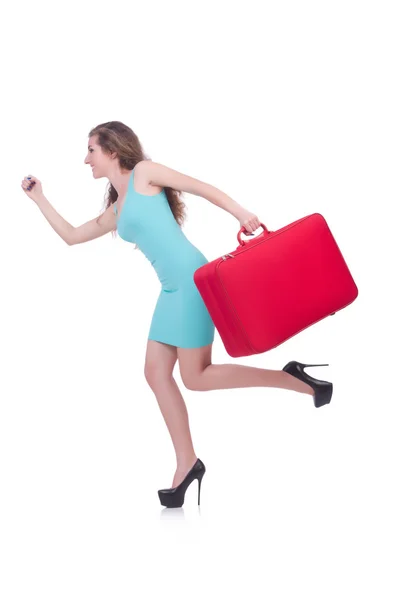 Женщина с чемоданом перед поездкой — стоковое фото