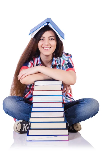 Student mit Büchern auf Weiß — Stockfoto