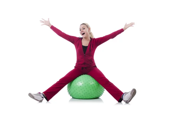 Young woman with ball exercising on whitee — Stock Photo, Image