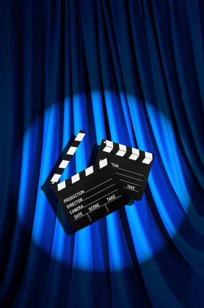 Movie clapper board against curtain — Stock Photo, Image