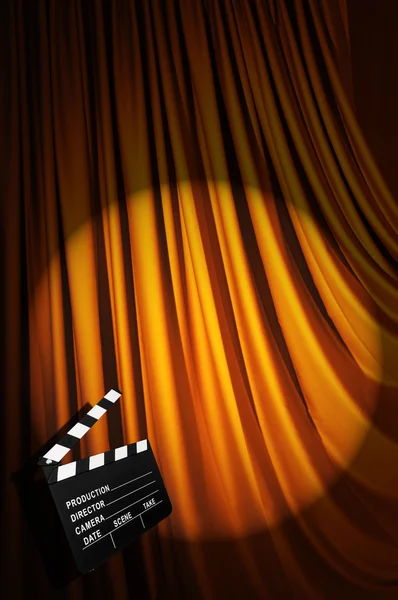 Movie clapper board against curtain — Stock Photo, Image