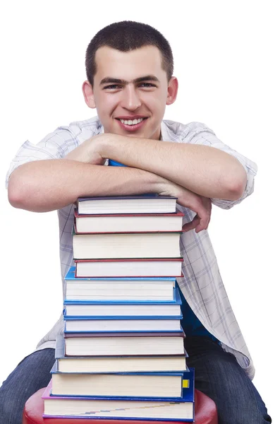 Estudante com muitos livros sobre branco — Fotografia de Stock